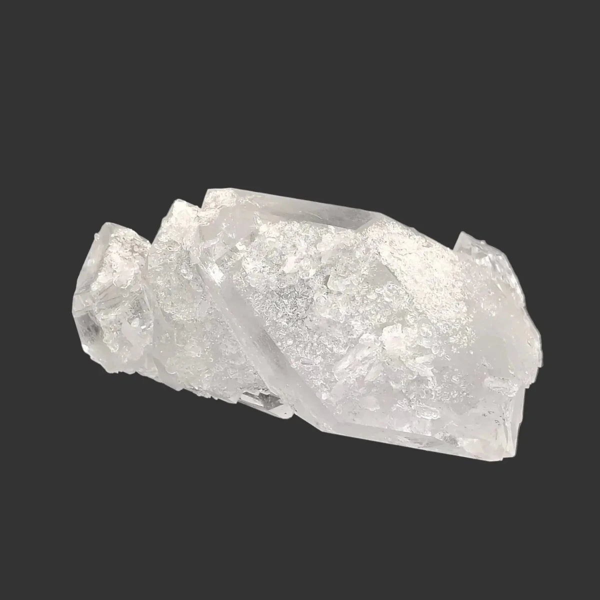 This is the back side of this double-terminated Quartz crystal cluster in front of a black background.
