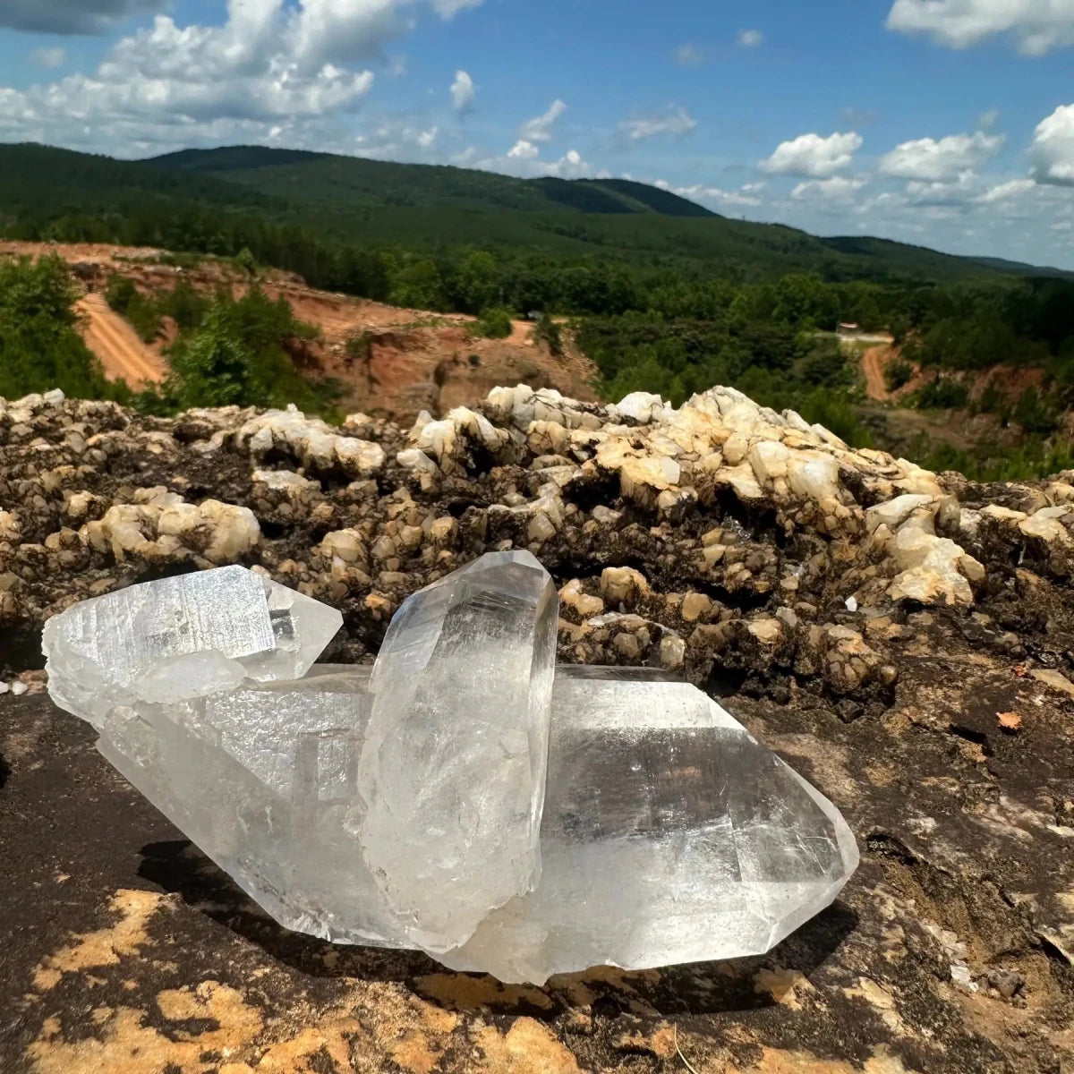 Unique Quartz Crystal On A Rock With Mine In The Background