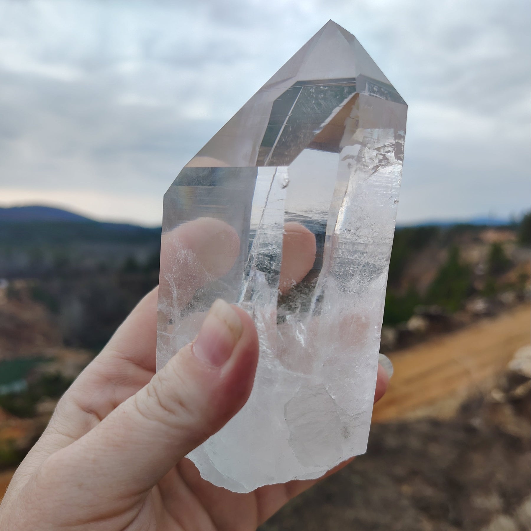 This is the left side of this water clear Quartz crystal point.