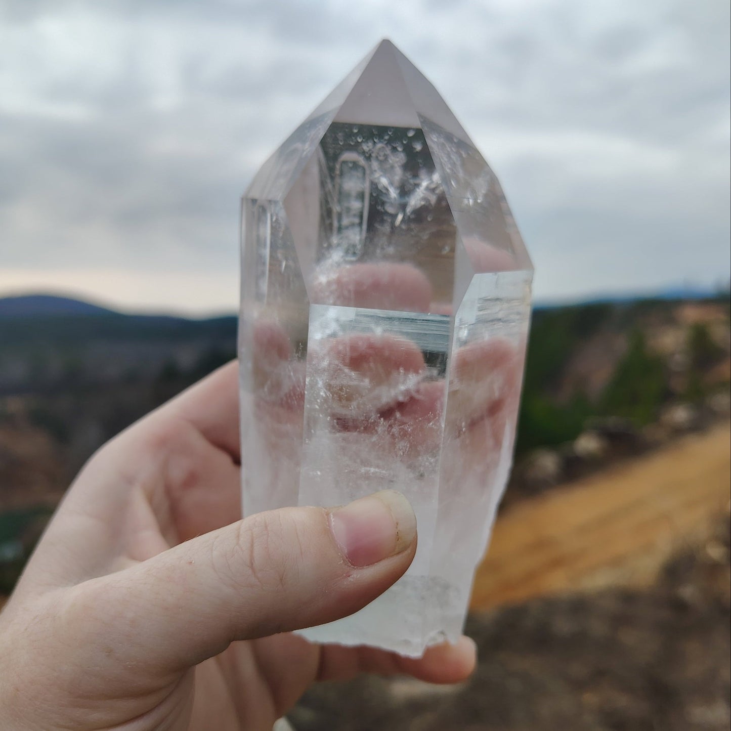 This is the front side of this water clear Quartz crystal point.