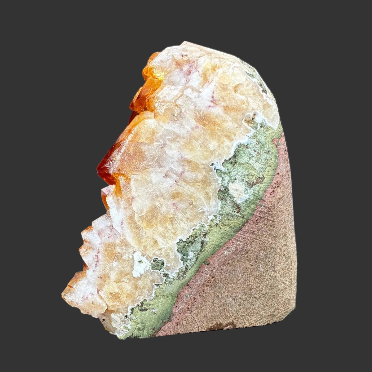 Left side of this citrine specimen, in front a black background.