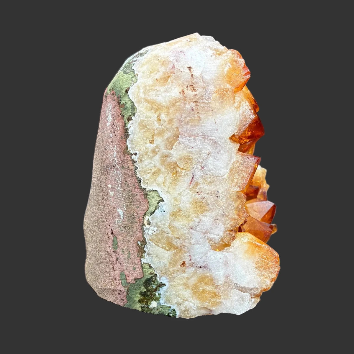 Right side of this citrine specimen, in front of a black background.