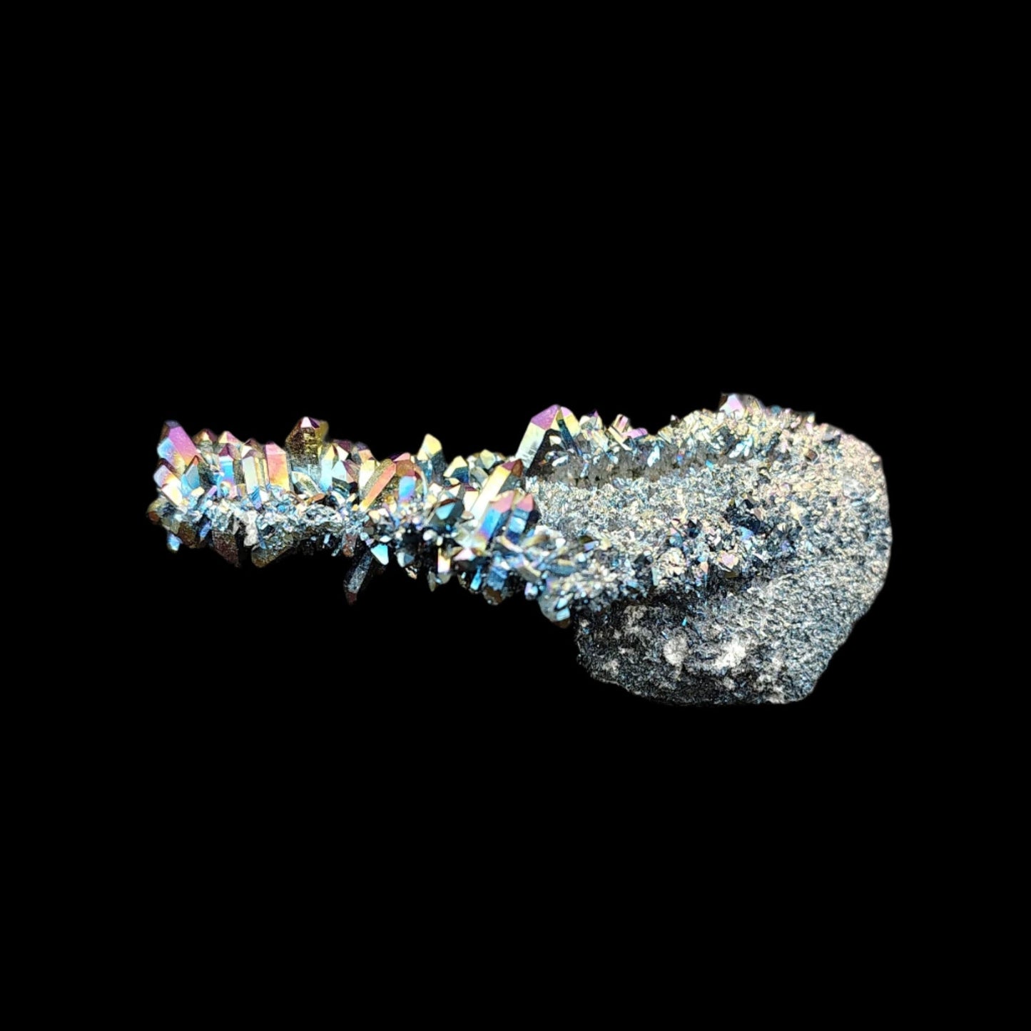 This is the back side of this rainbow aura druzy cluster