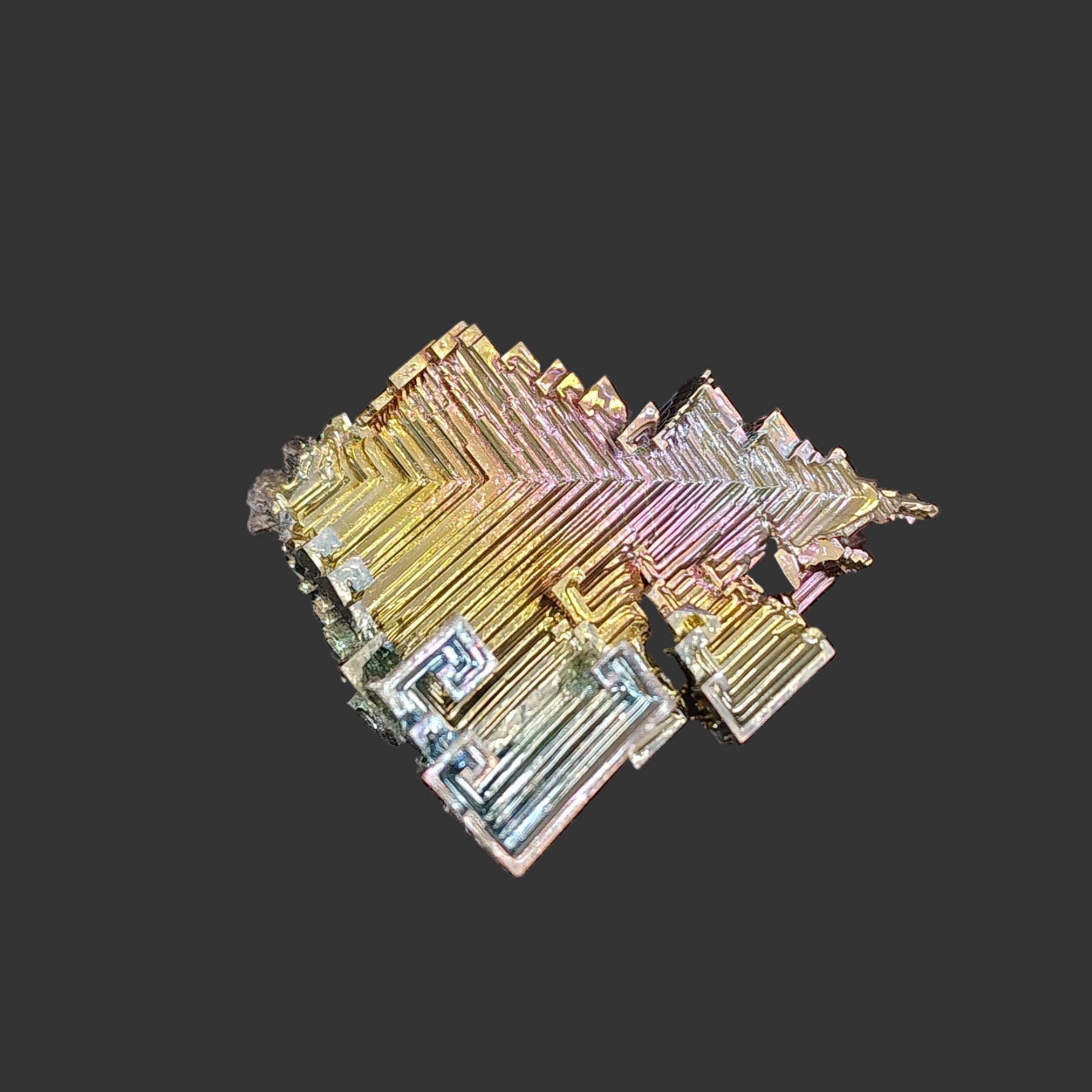 This front side of this Bismuth specimen is multicolored. It is pink, blue, and orange.