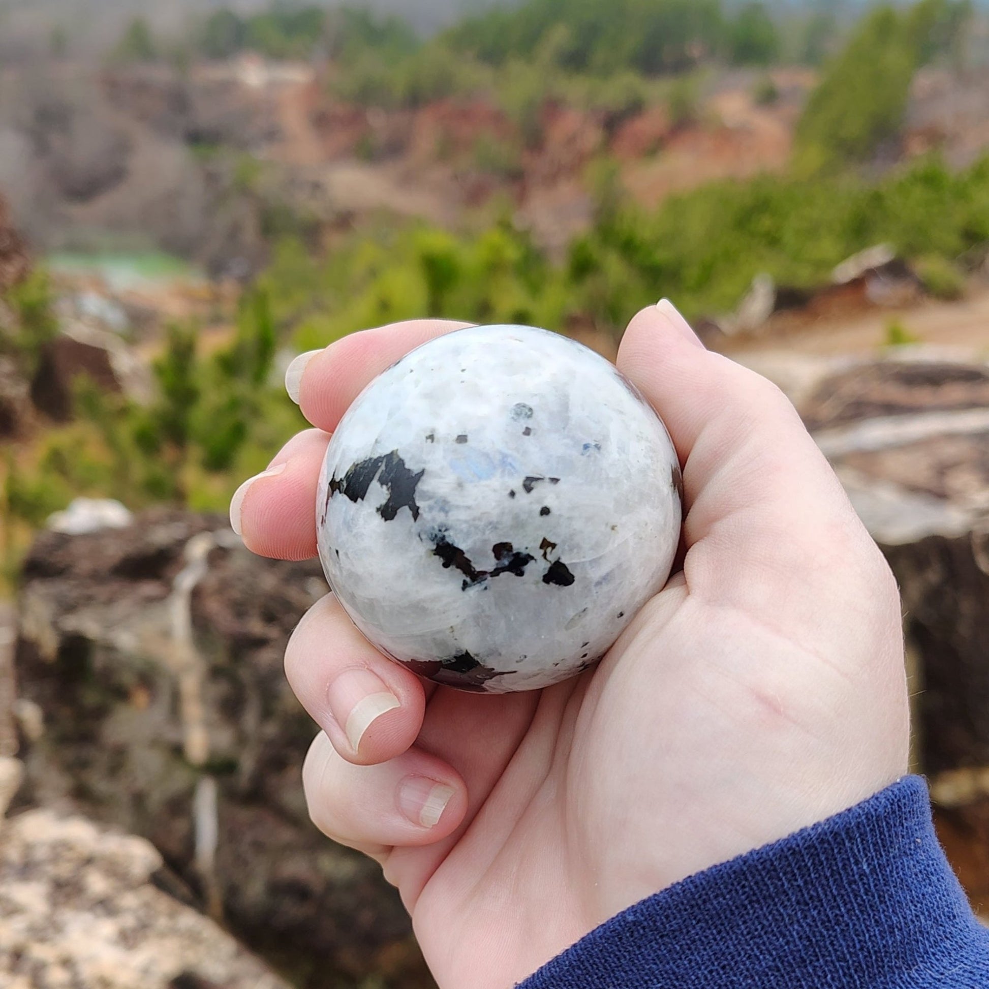 This is another picture of this rainbow Moonstone sphere from another angle.