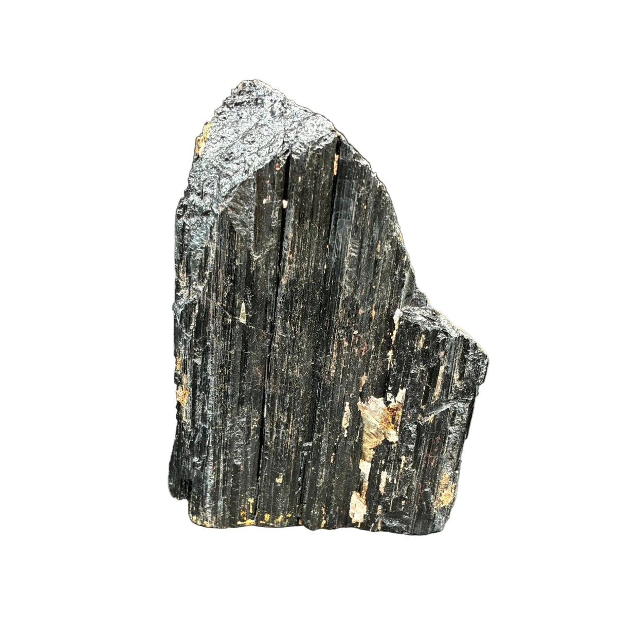 Back side of this raw black Tourmaline cut base piece, in front of a white background.