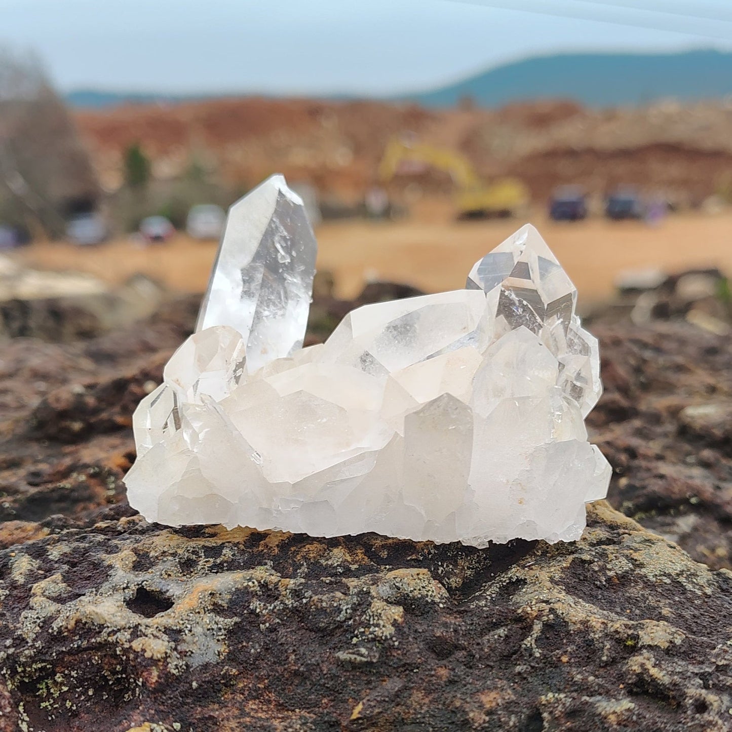This is the front side of this small raw and clear Quartz crystal cluster.