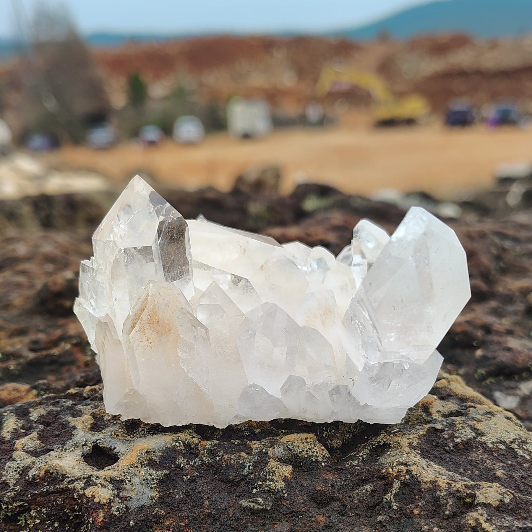 This is the back of this small raw clear Quartz crystal cluster.