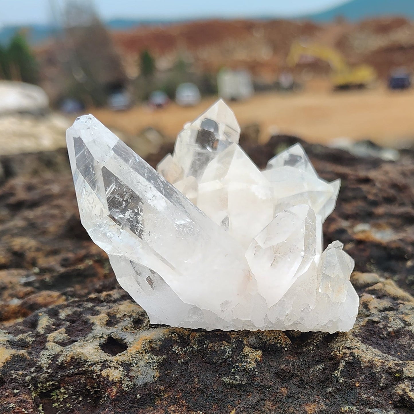 From the right side, you get a better view of the biggest crystal point on this Quartz cluster.