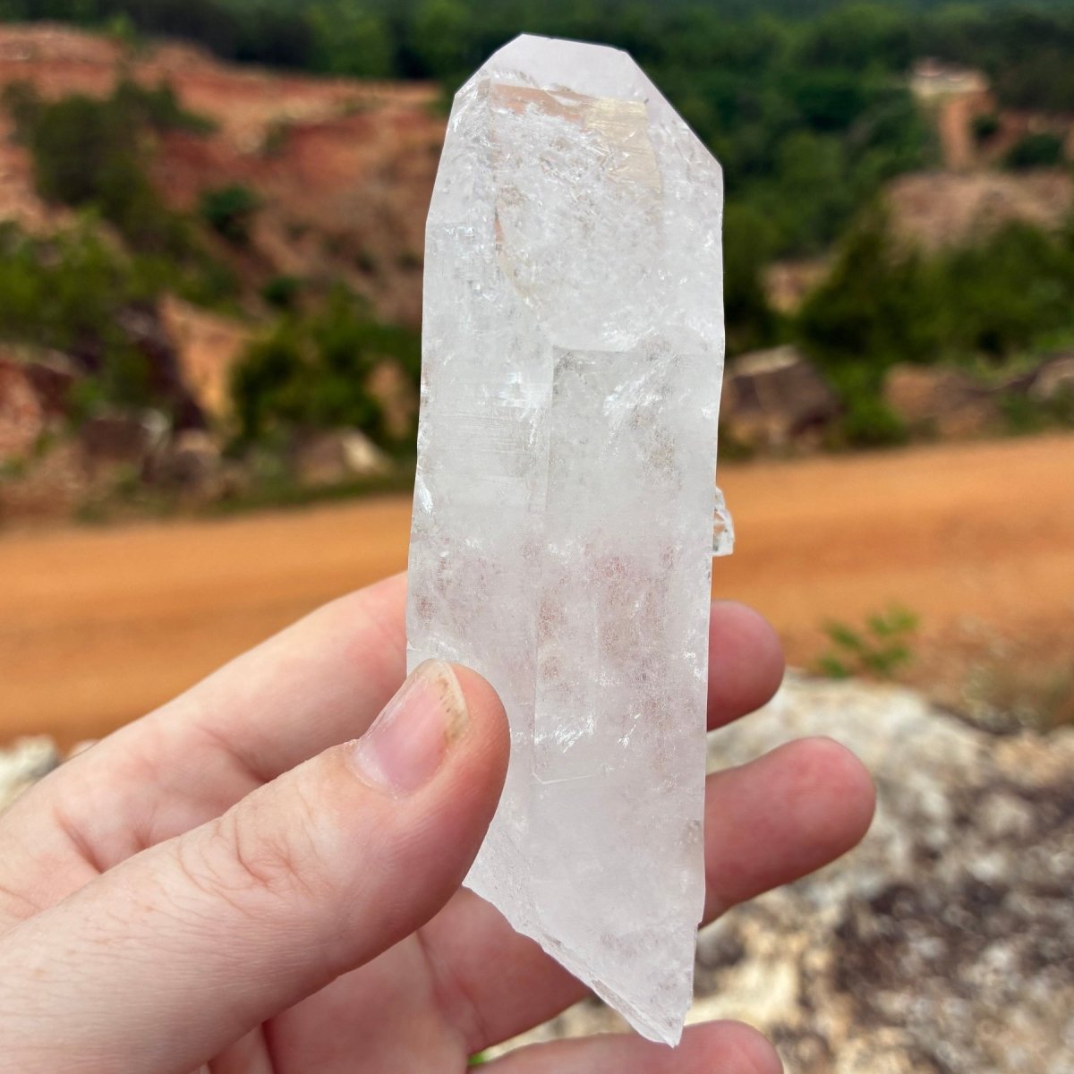 This is the back side of this Quartz crystal cluster, outdoors and in front of the Ron Coleman crystal mine.