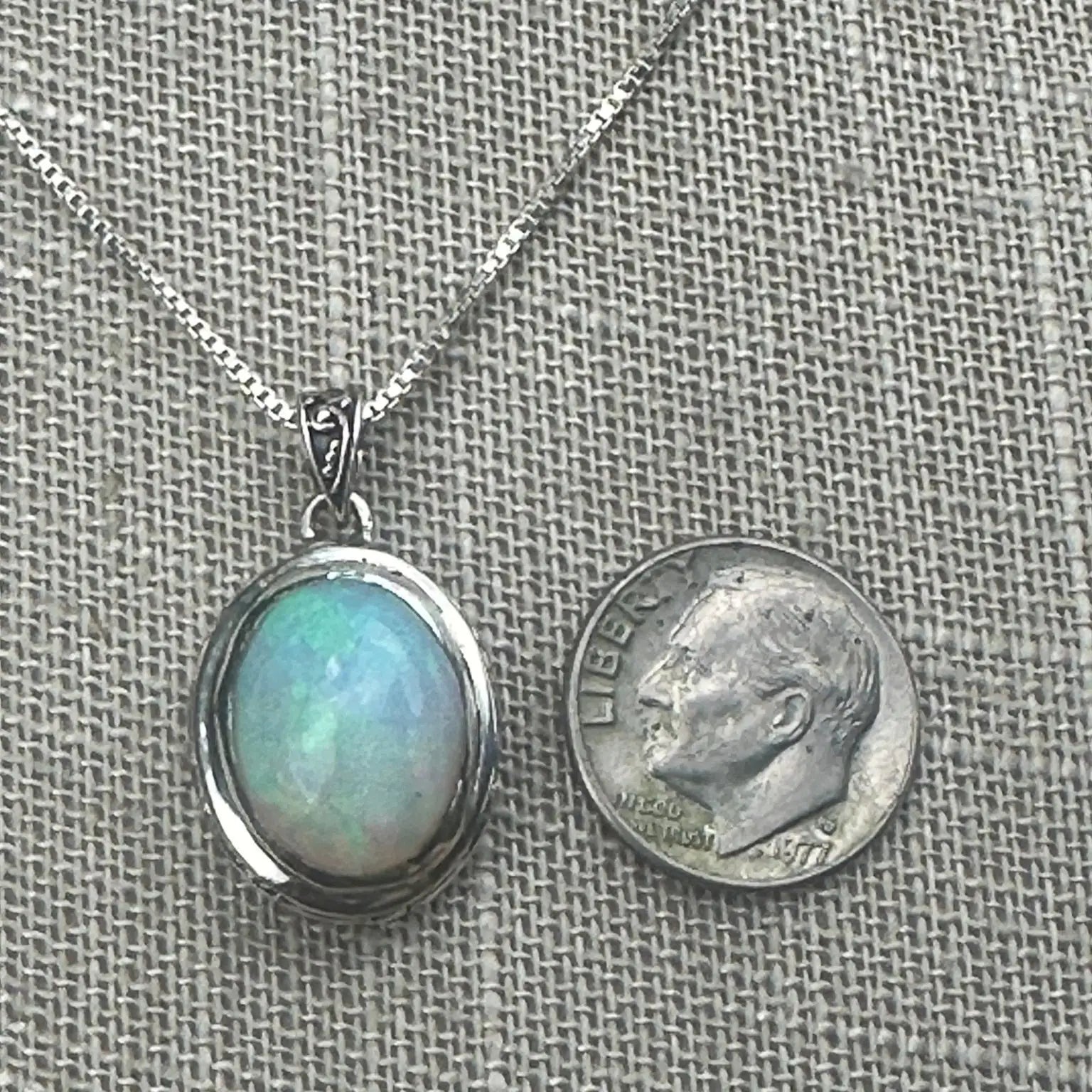 Opal Sterling Pendant On Chain with a dime next to it to show scale