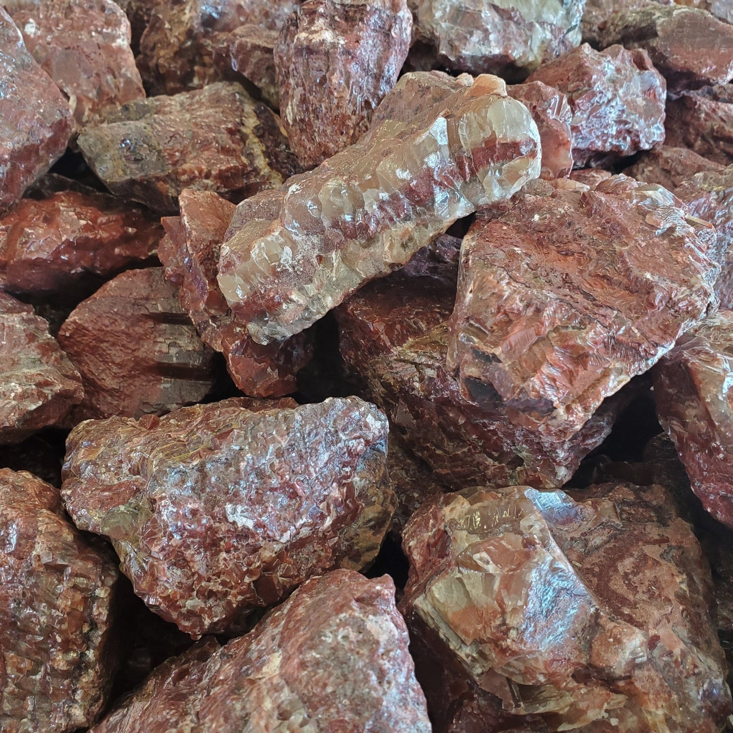 Red Calcite Stones On A Table