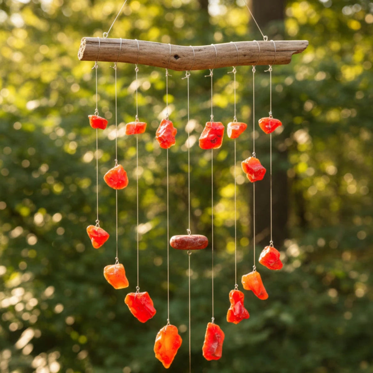 This is a outdoor wind chime made out of red and orange slag glass.