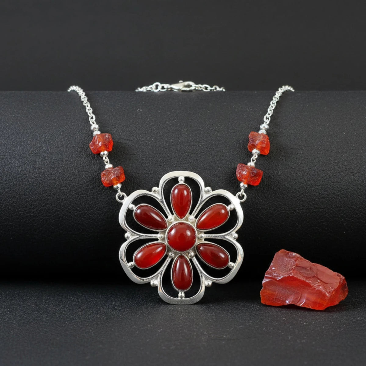 Red slag that has been used for making jewelry.