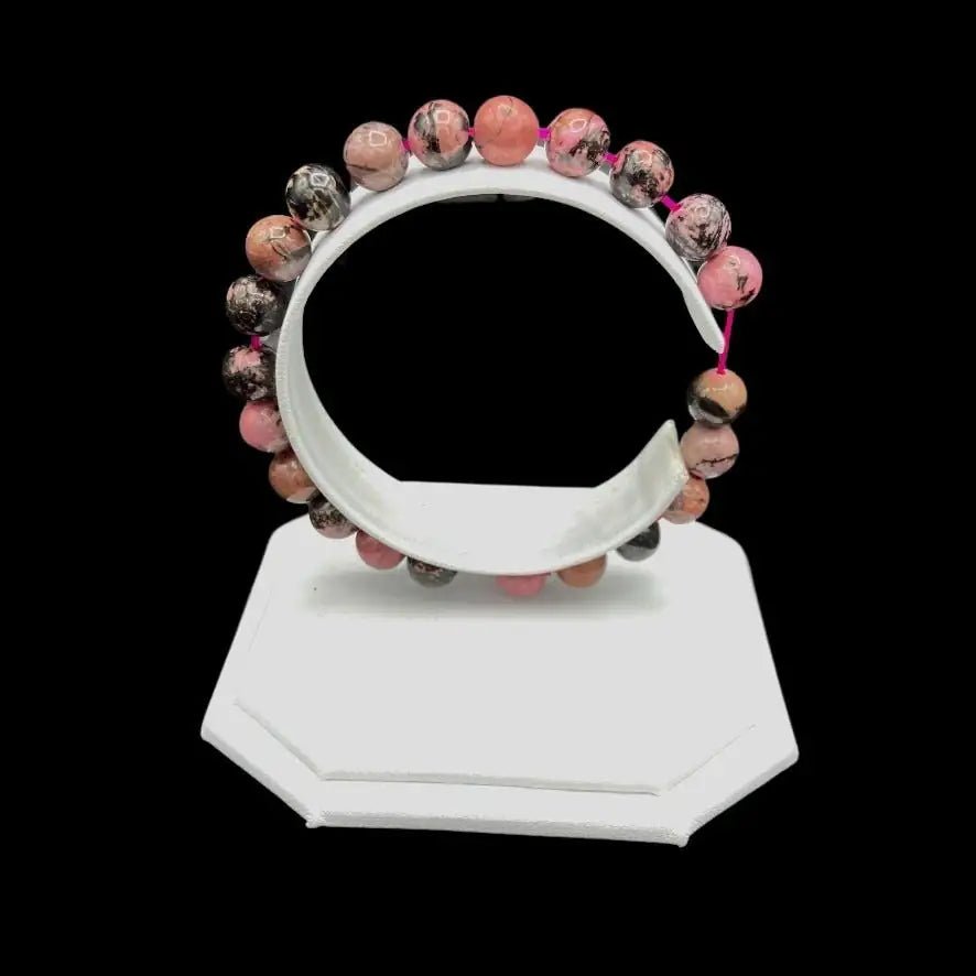 Side View Of Rhodonite Bracelet on a white display stand