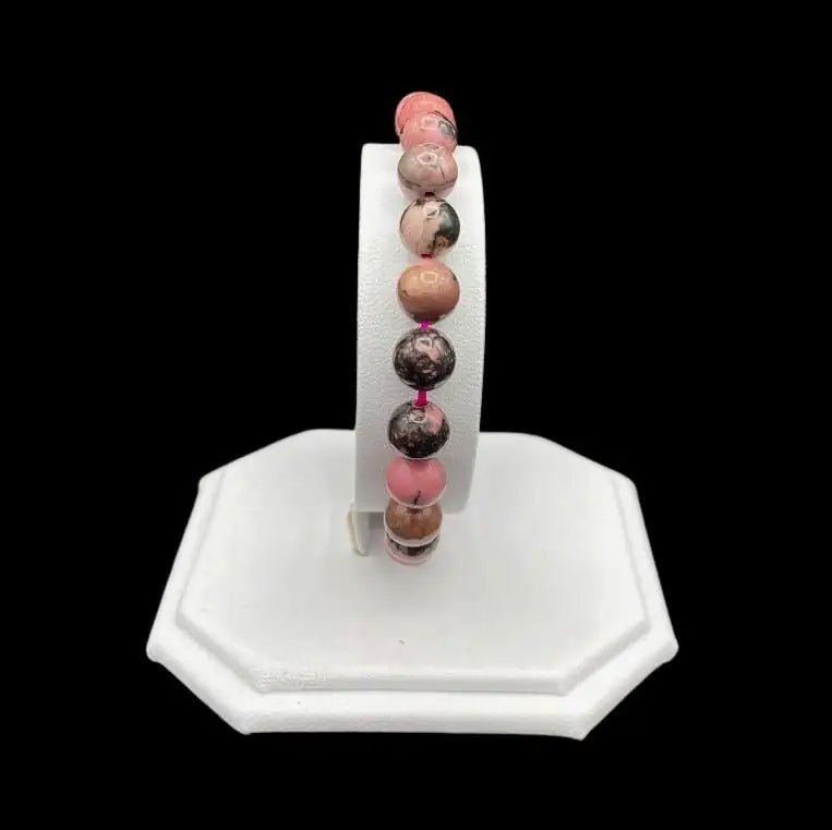 Front View Of Rhodonite Bracelet on a white display stand