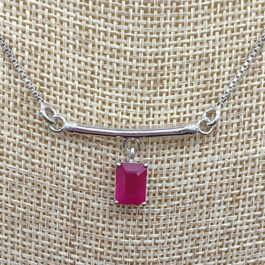 This is a close up of this rectangular red ruby pendant