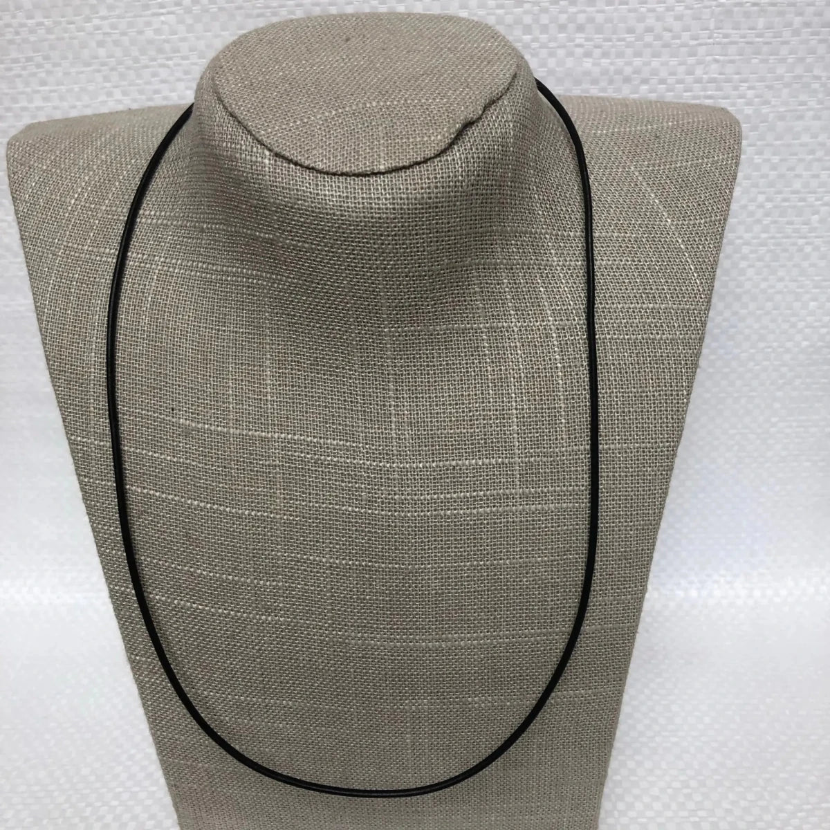 Black Leather Cord Necklace On A DIsplay Neck