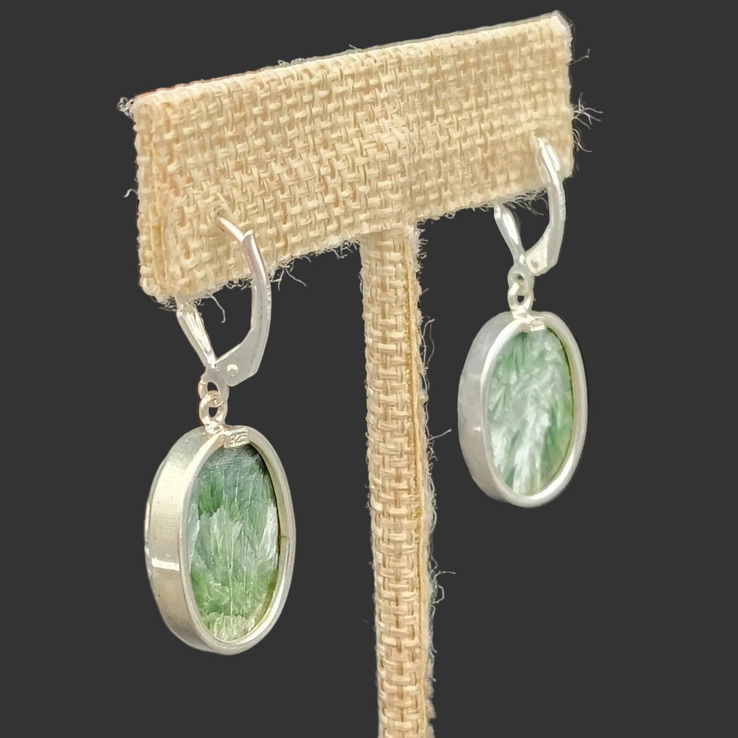 Close up of the Sterling Silver clasp on the back of these green and white Seraphinite earrings.