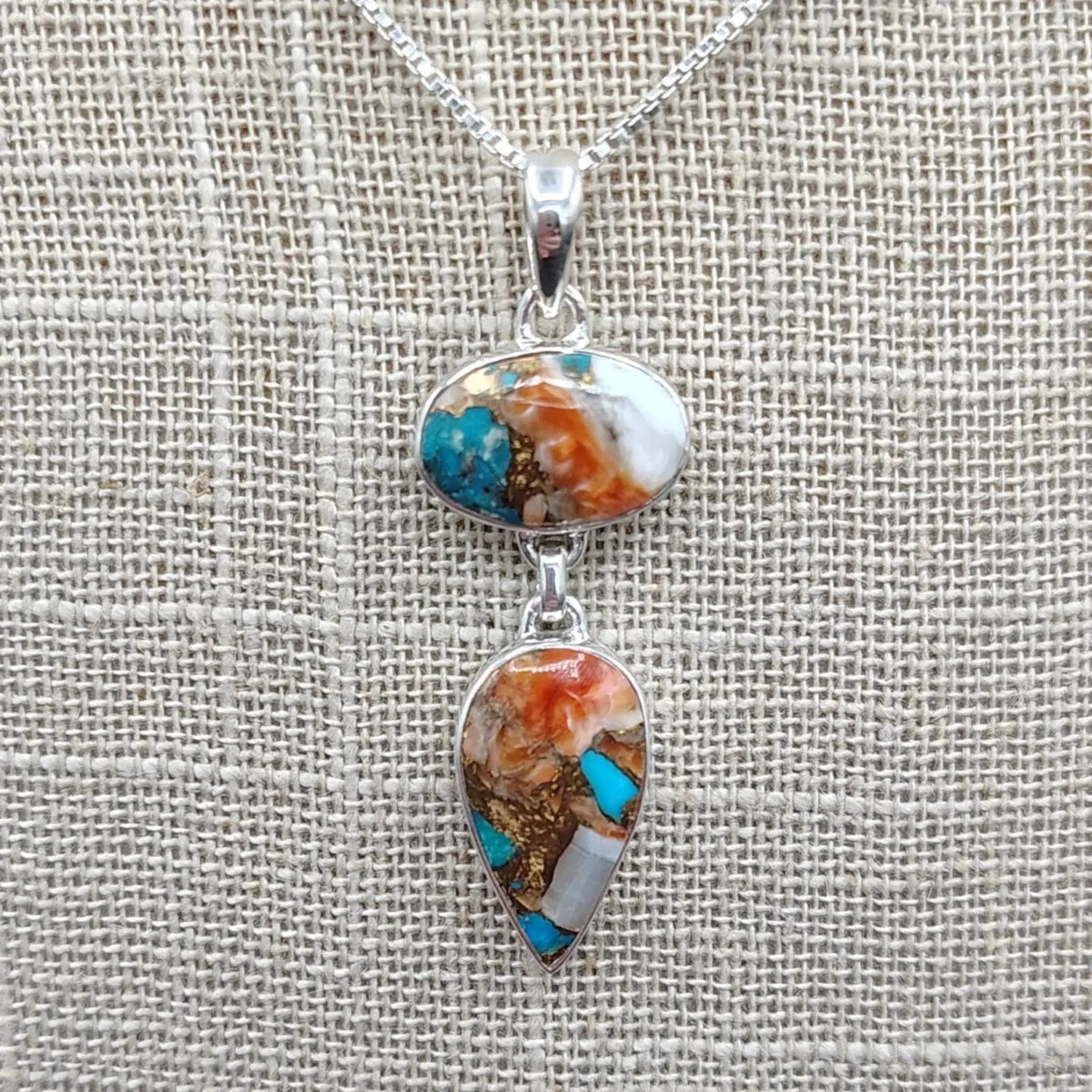 This is a close up of the Sterling Silver and Oyster Turquoise pendants