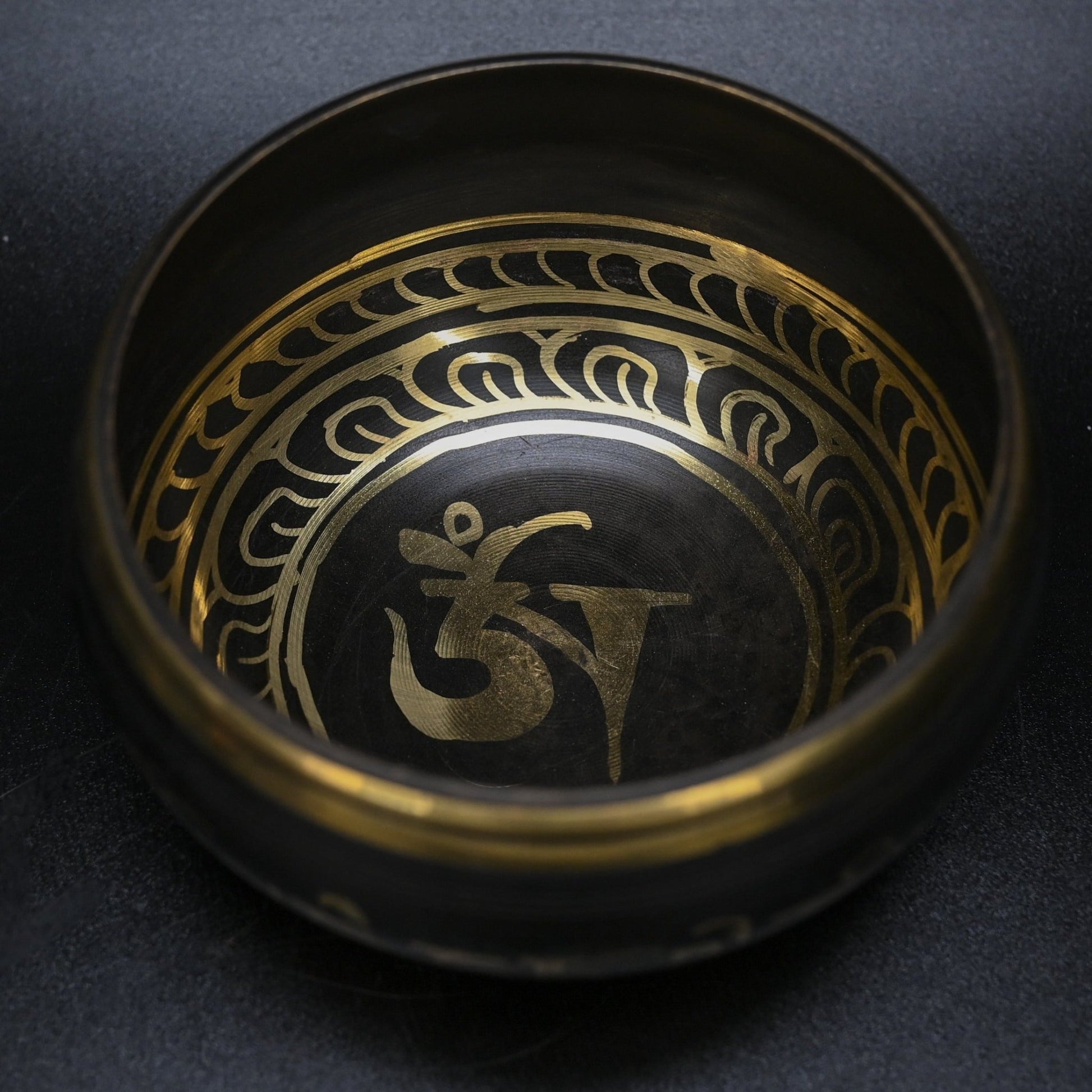 Chakra Symbol Inside A Brown Metal Singing Bowl