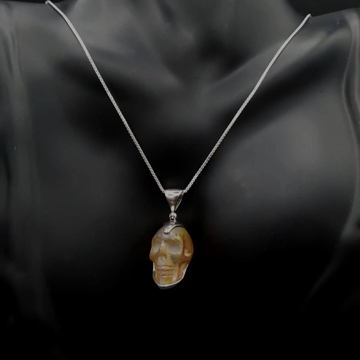 Crystal Skull Pendant on black neck display