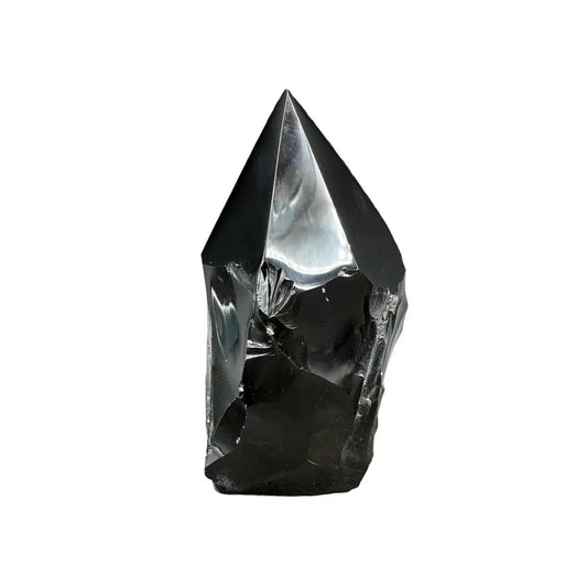 This is the front side of this polished black Obsidian point in front of a white background.