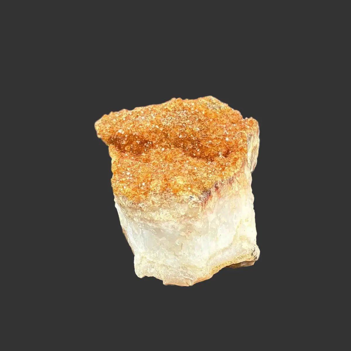Side view of this Citrine Specimen in front of a black background.