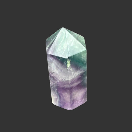 This is the front side of this polished green and purple Fluorite point.