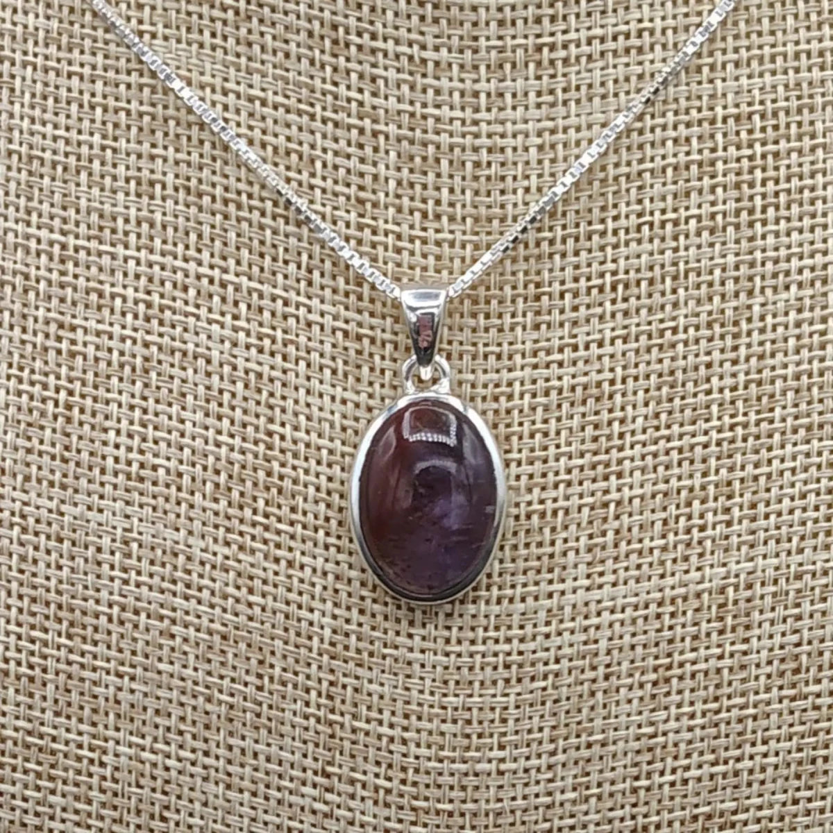 This is a close up of this small Sterling Silver Cacoxenite Amethyst pendant