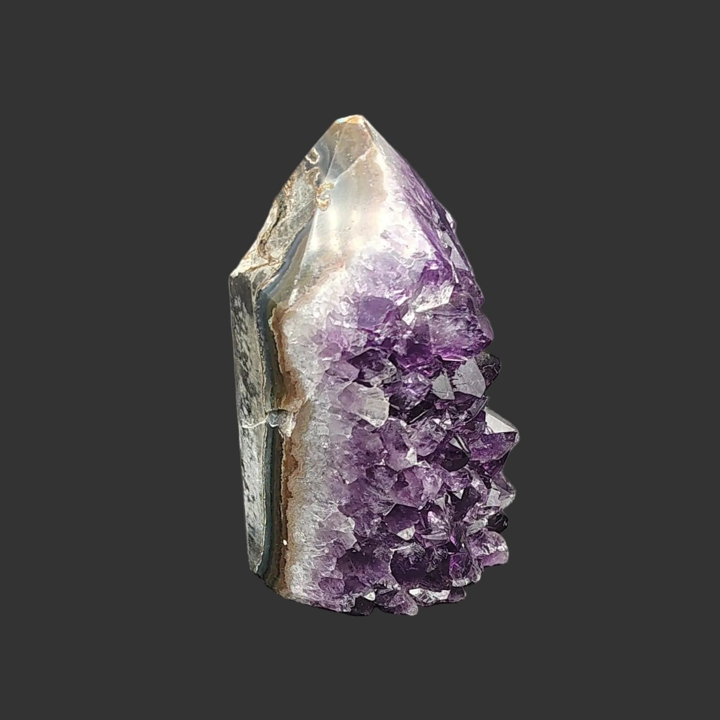 On the right side of this tower, you can see bands of polished Agate and Quartz.