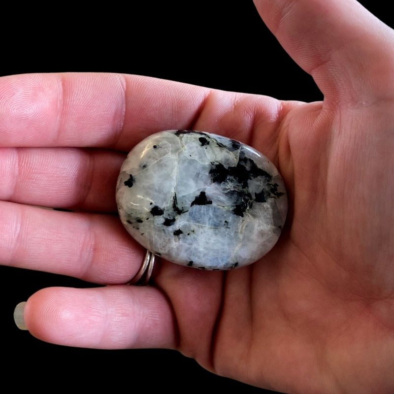 Polished Rainbow Moonstone In Natural Light, Iredecent White With Black Specks