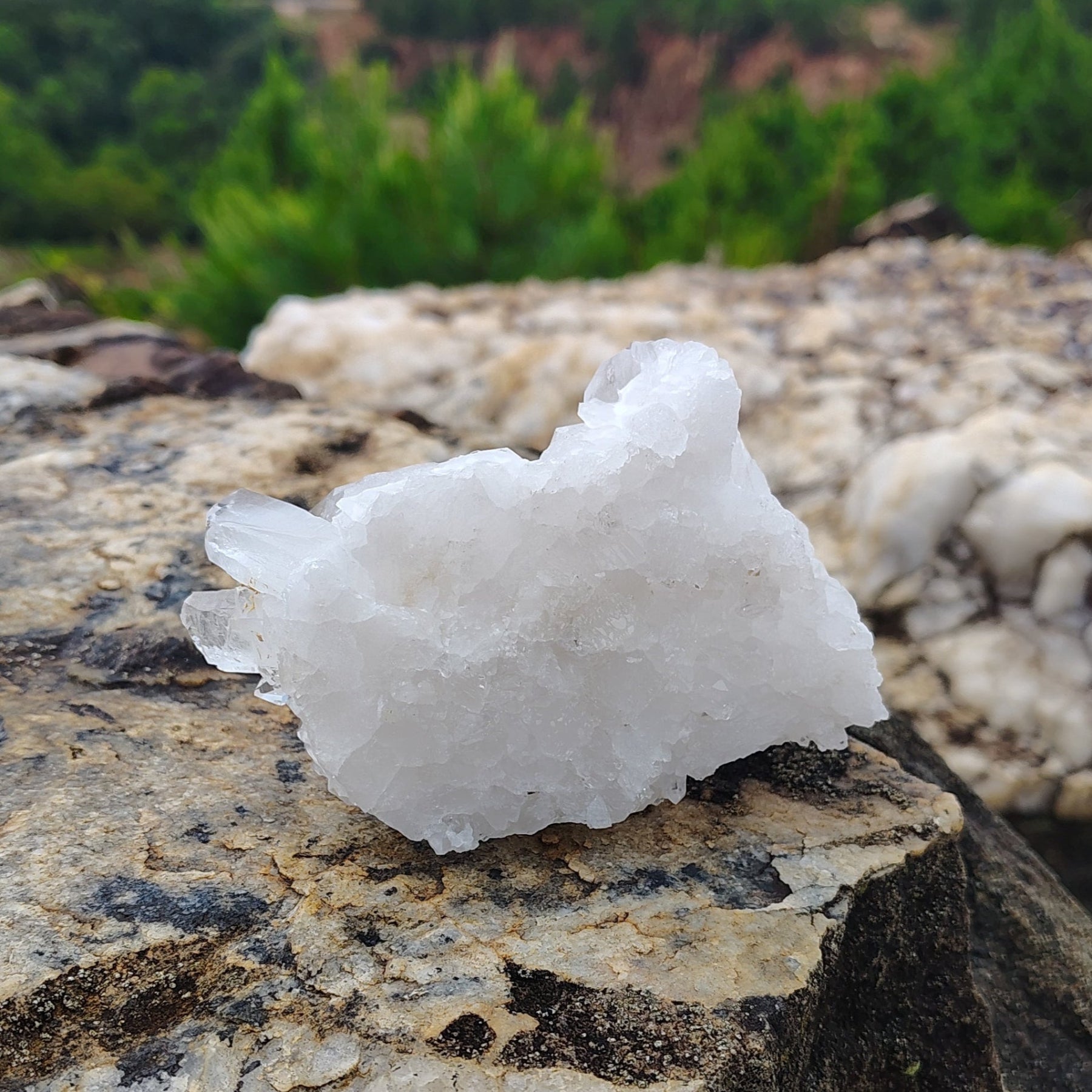 This is the glass back on the bottom of this small quartz cluster