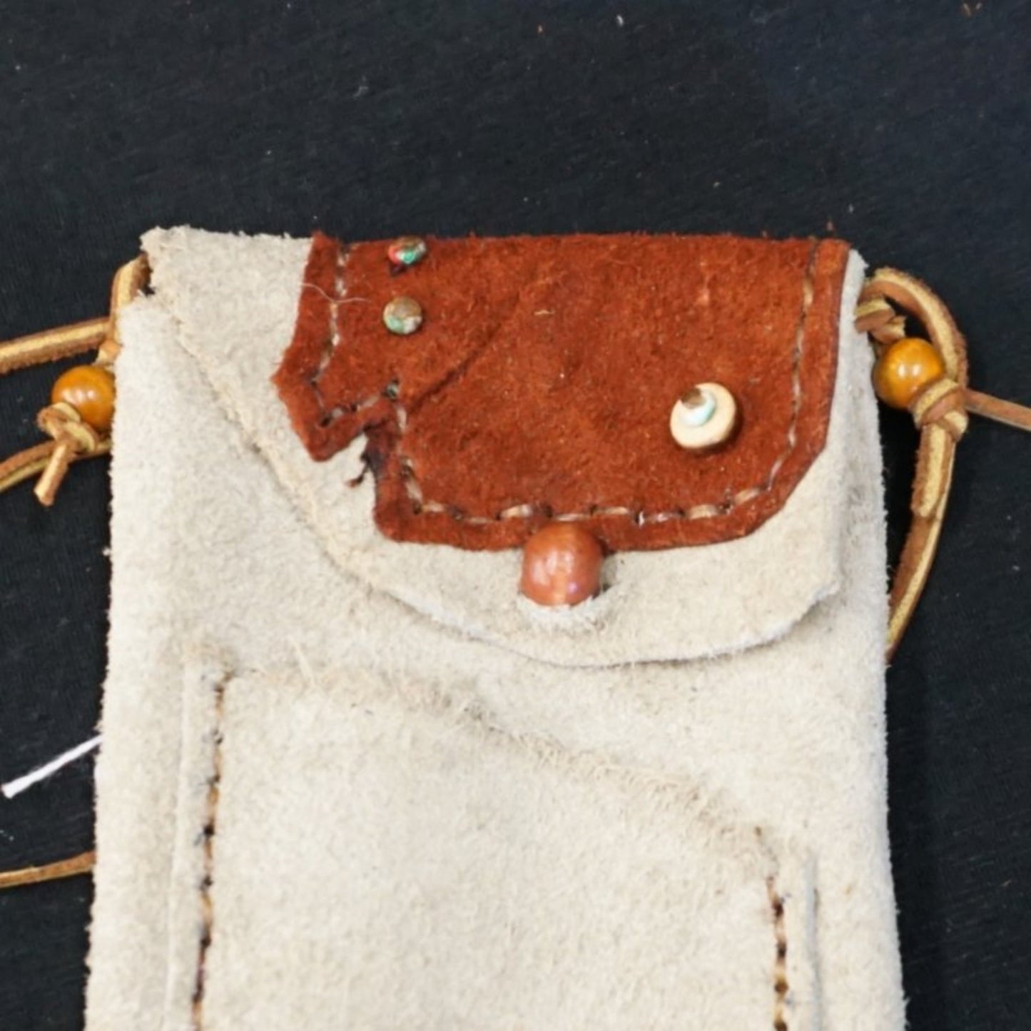 Ivory color small leather cross body pouch purse with brown leather accent and brown leather cord strap