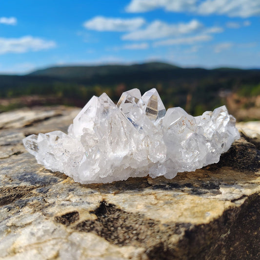 This is the front side of this small water clear quartz cluster.