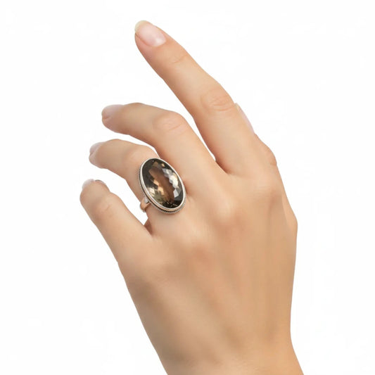 Sterling Silver Smoky Quart ring on a lady's ring finger.