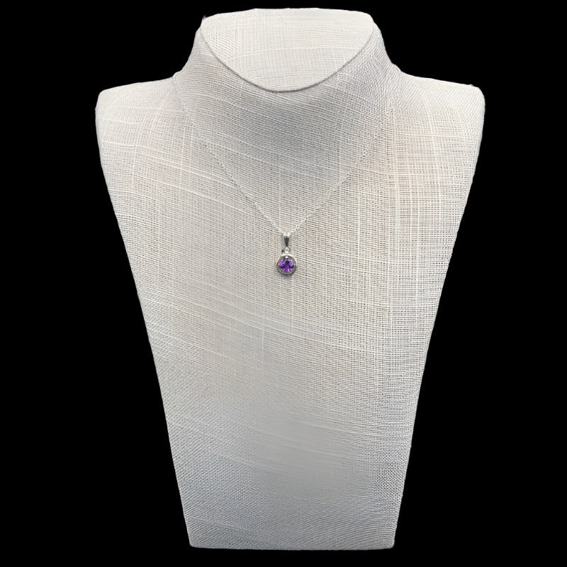 Front View Of Sterling Silver And Petite Amethyst Necklace. Gemstone Is Round In Shape, Silver And Purple In Color