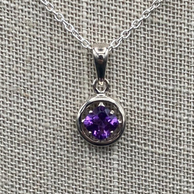 Close Up Of Amethyst Gemstone. Silver And Purple In Color