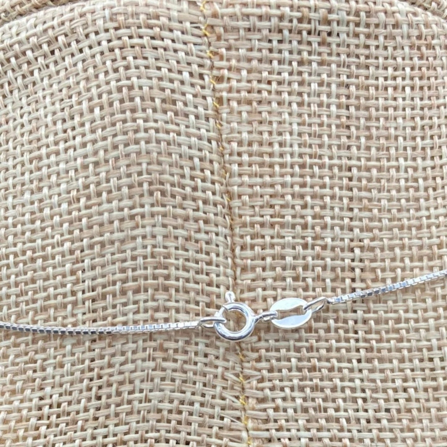 Close up of the Sterling Silver Spring ring clasp in this necklace