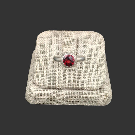 This Sterling Silver red Garnet ring is circular in shape.