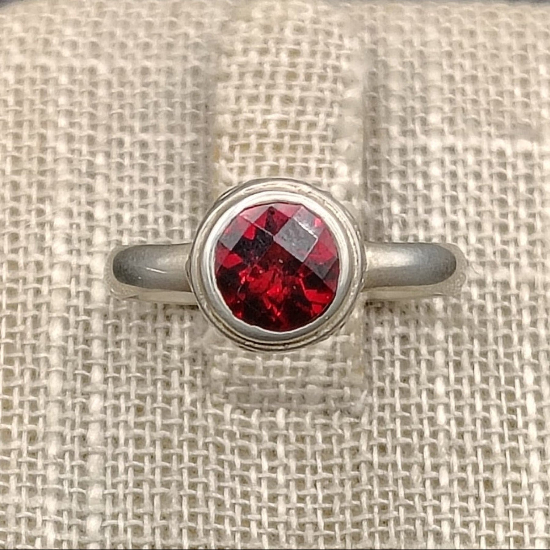 Close up of this Sterling Silver and red Garnet size 8 ring.