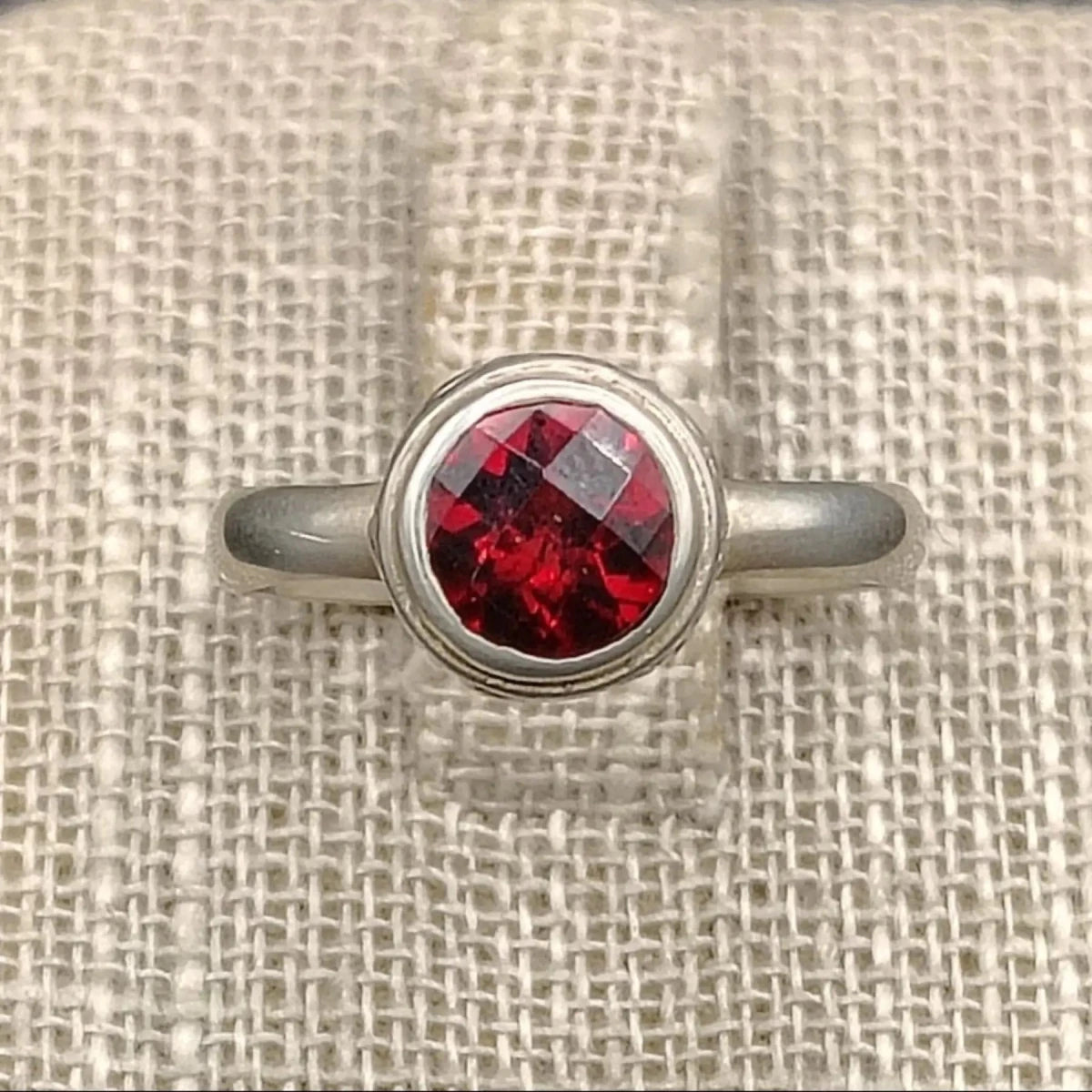 Close up of this Sterling Silver and red Garnet size 8 ring.