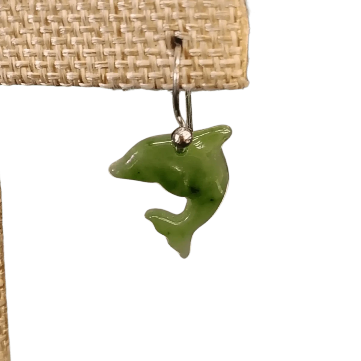 This is a close up of one of the Jade dolphins earrings