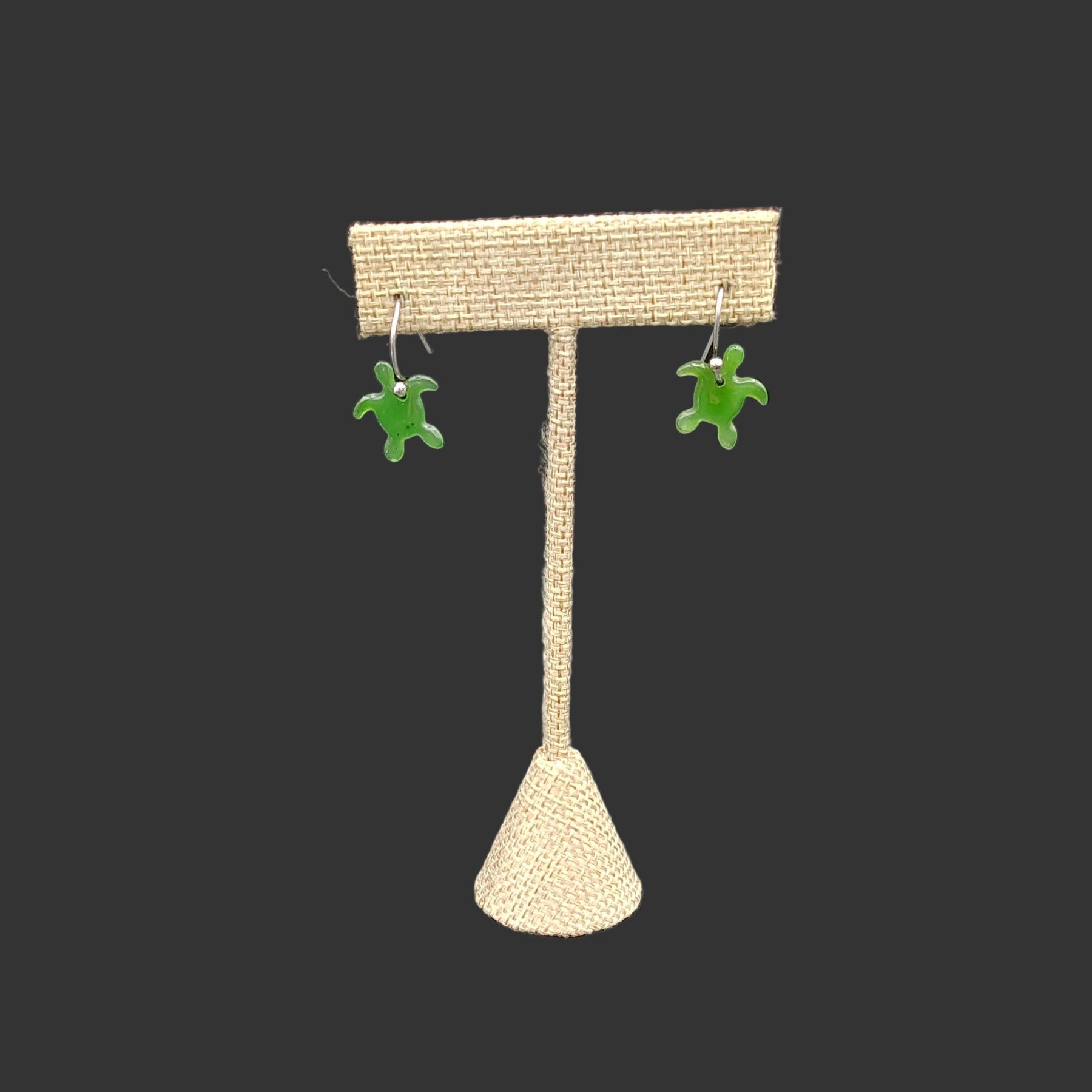 This is the front side of the earrings, the polished green jade sea turtles that dangle freely.