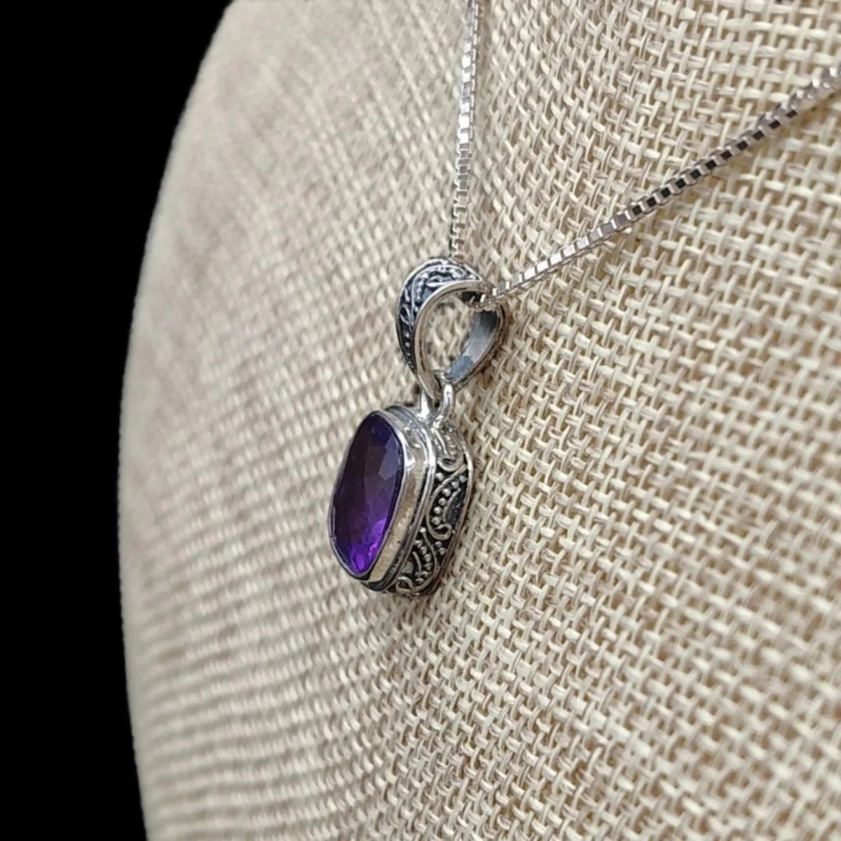 This is a close up of the side of this Sterling Silver and Amethyst pendant