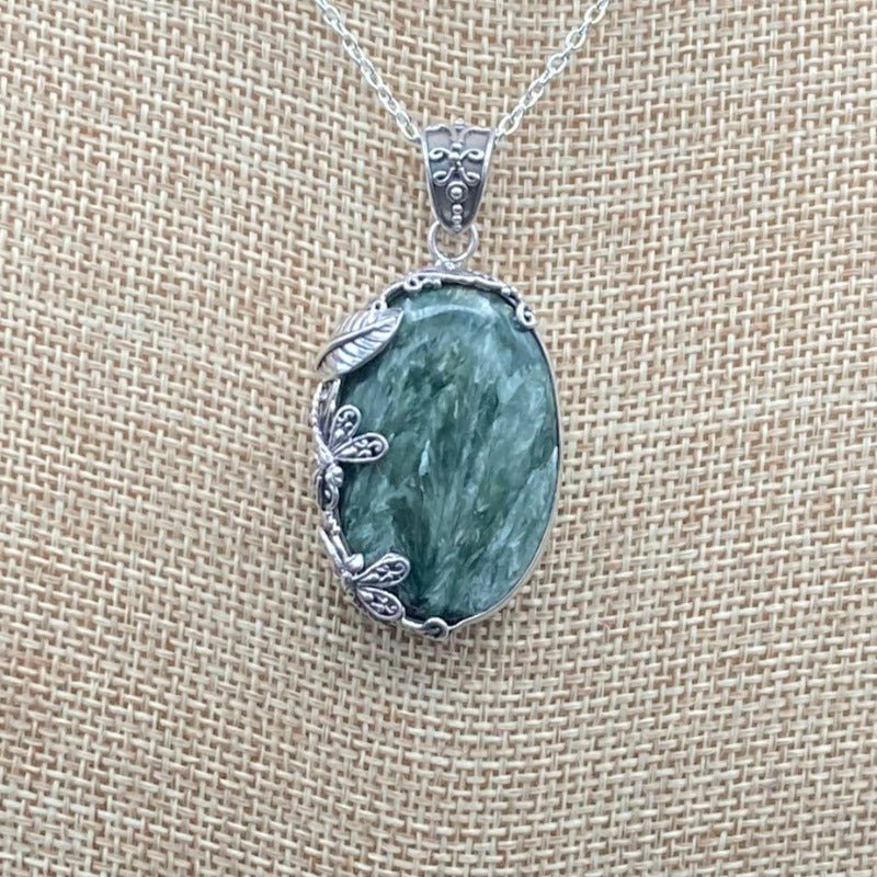 Close Up Of The Seraphanite Pendant. Different Hues Of Green And White