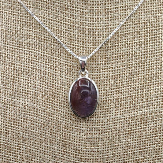 This is a close up of this small Sterling Silver Cacoxenite Amethyst pendant