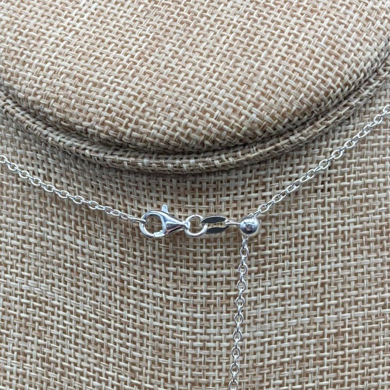 Close Up Of Adjustable Sterling Silver Necklace And Lobster Claw Clasp.