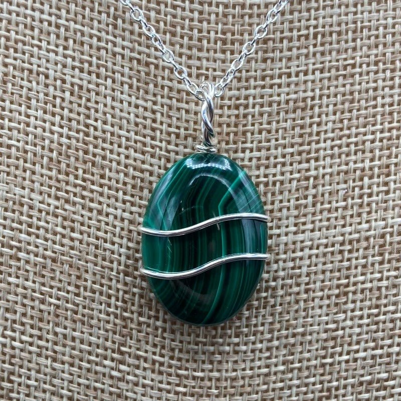 Close Up Of Sterling Silver Wire Wrapped Green Malachite Pendant