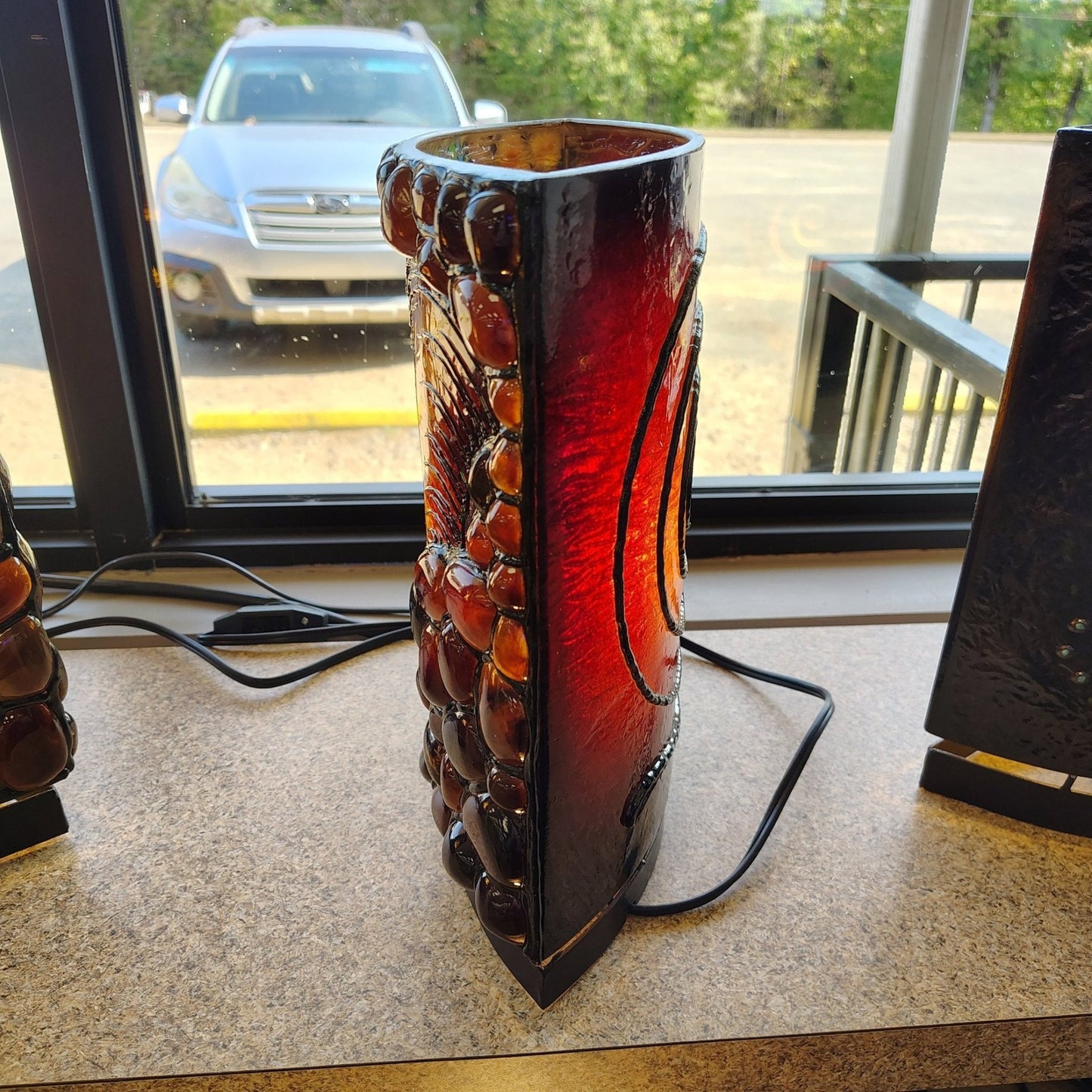 This is the side view of this Sumatra Amber Ganesha face table lamp